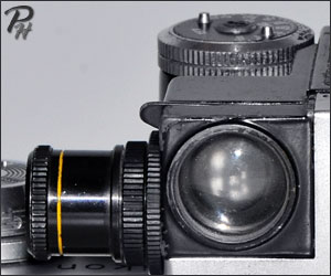photomic incidence and telephoto attachment stored on battery cover